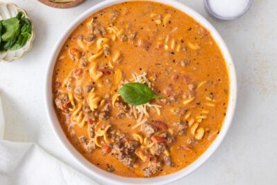 Creamy tomato soup filled with spiral pasta and beef.