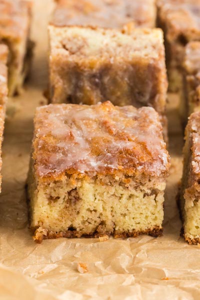 Close up of slices of coffee cake on parchment paper.