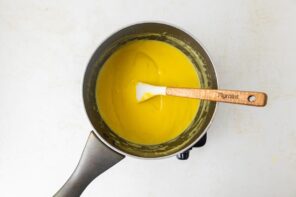 Thick coconut custard in a saucepan.