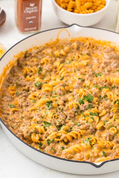 Creamy and cheesy ground beef casserole in a skillet.