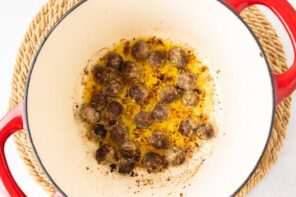 Small meatballs seared in a Dutch oven.